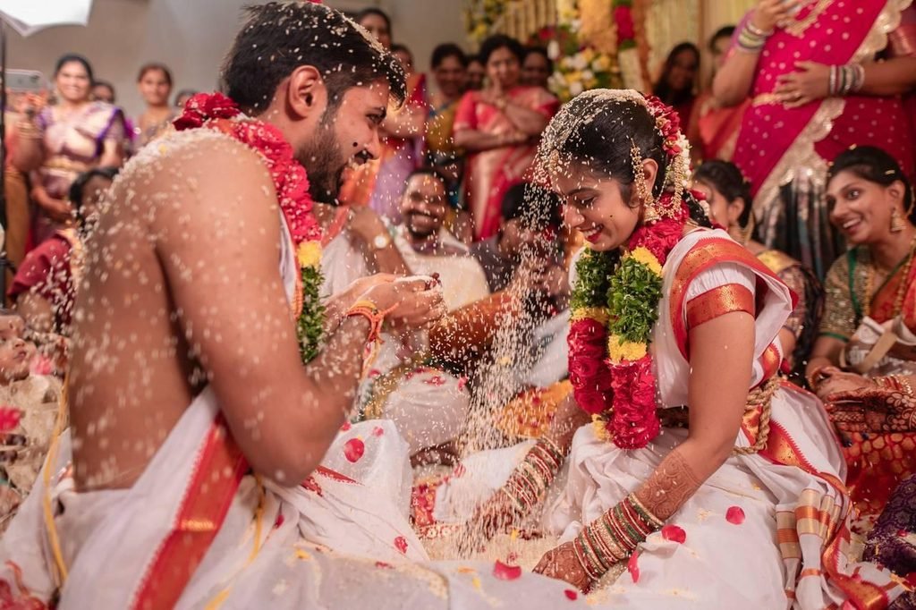 South Indian bride and groom participating in a traditional wedding ritual